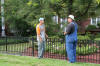 Monroe Lawn Care team member demonstrating professional commercial mowing technique